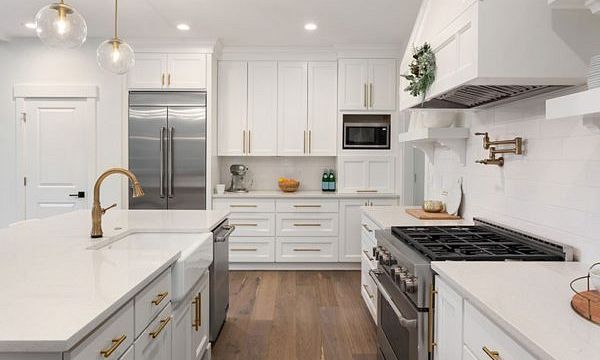 A photo of a kitchen that features a range hood