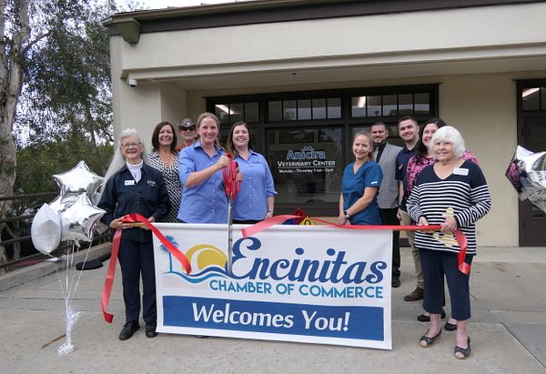 Ribbon cutting of new Anicira clinic in San Diego. The sign in the image reads: Encinitas chamber of commerce welcomes you!