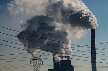 Coal production plant smokestacks spewing emissions