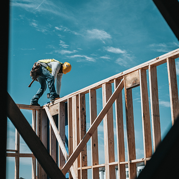 Construction worker on building frame