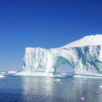 Melting iceberg floating at sea