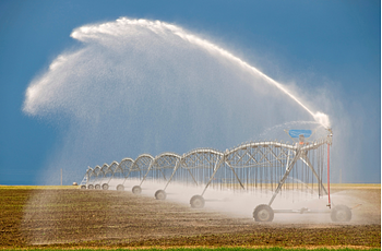 Large irrigation equipment spraying field