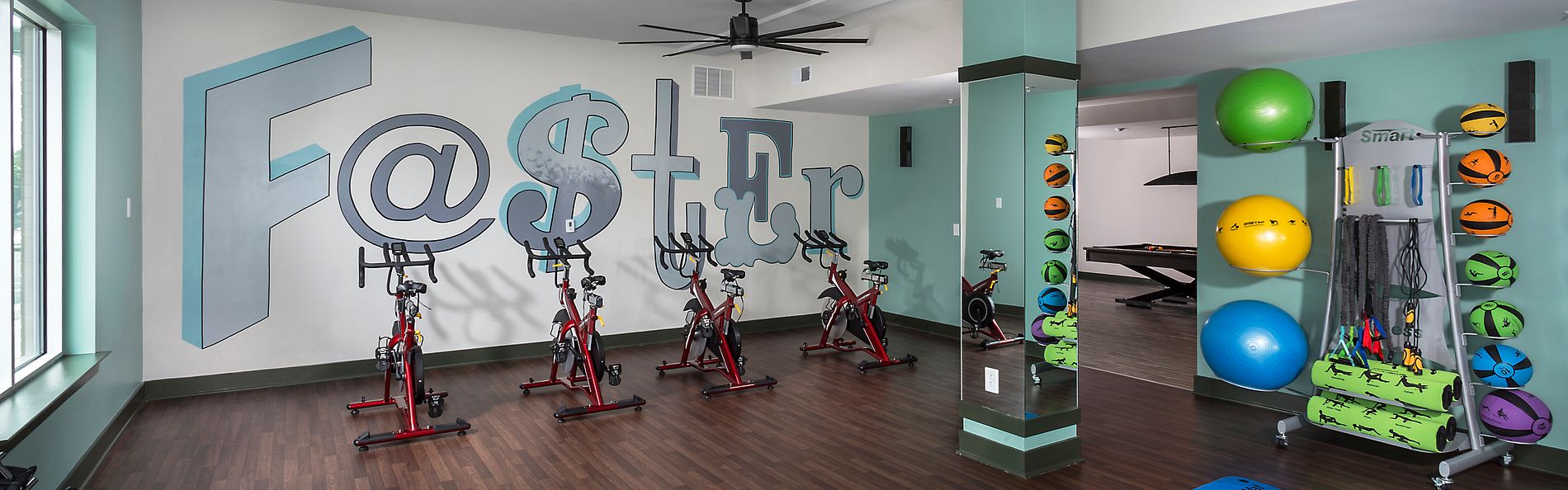 Gym located in Gather Uptown Apartments built by Clancy & Theys Construction Company