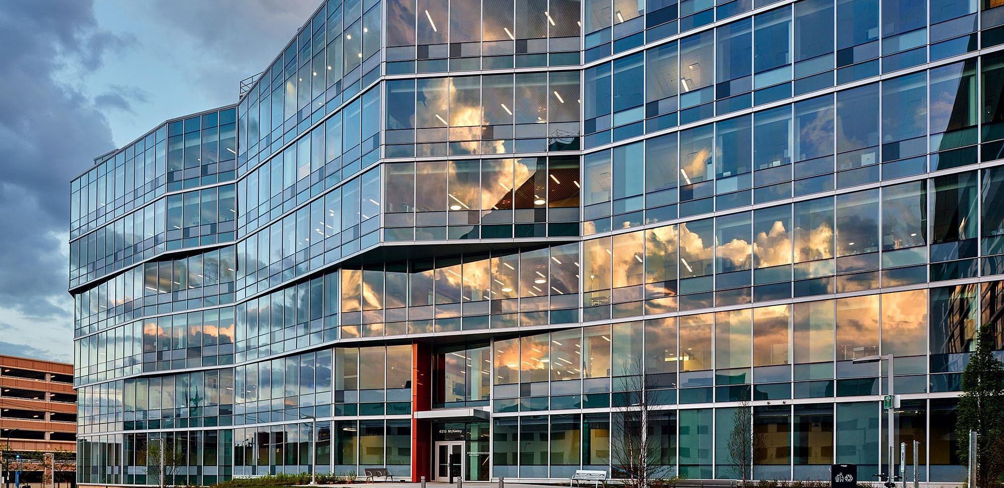 Exterior Glass Facade on the Debra and George W. Couch III Biomedical Research Building at Sunset