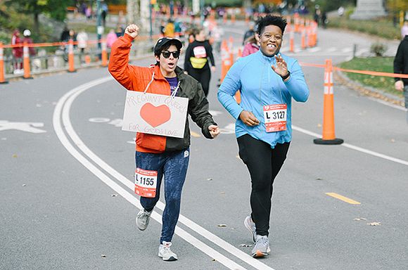 A photo of Liz Alpern and Mavis-Jay Sanders running at the Race to Deliver.