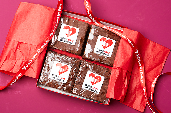 4-pack of brownies in red box with ribbon overlaying it