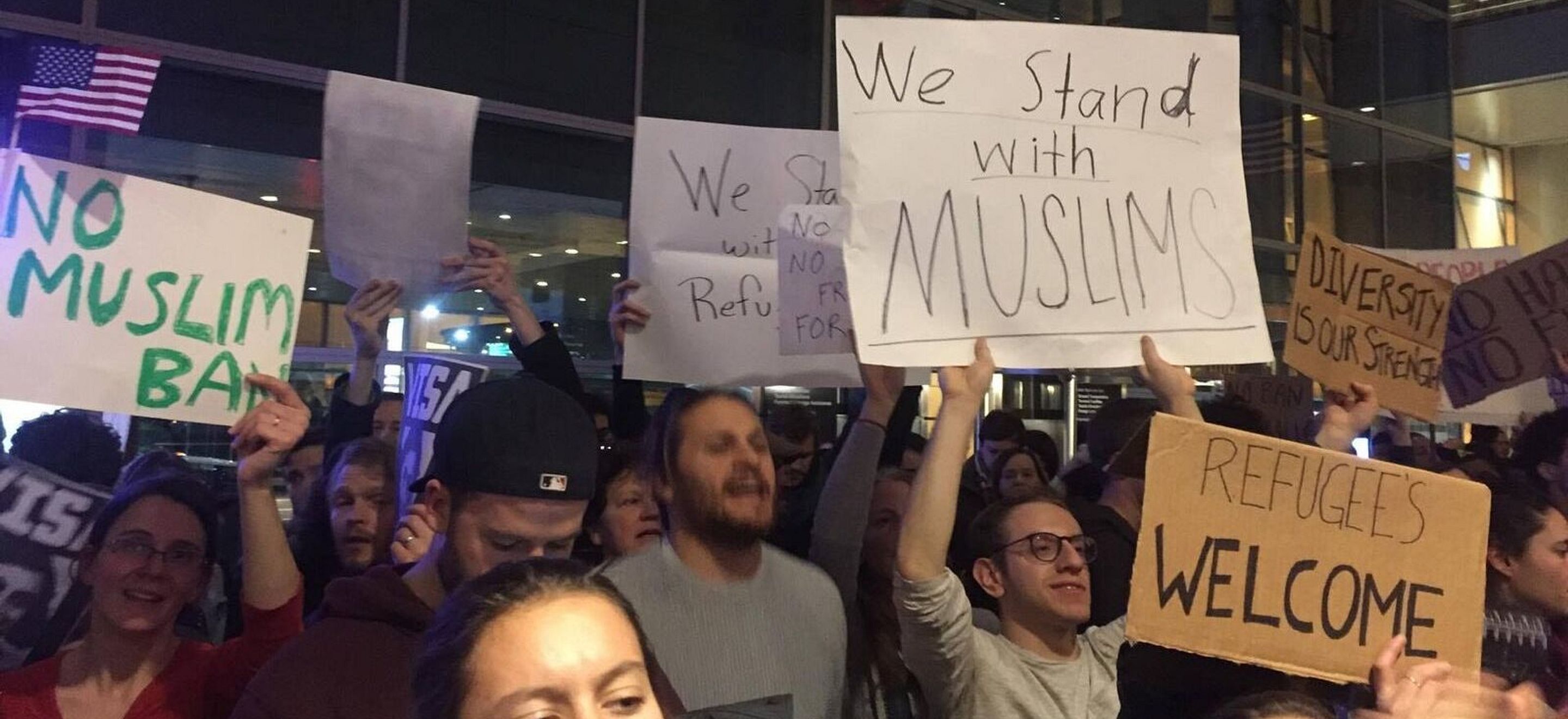 Protesters rally against the Muslim ban at Logan airport