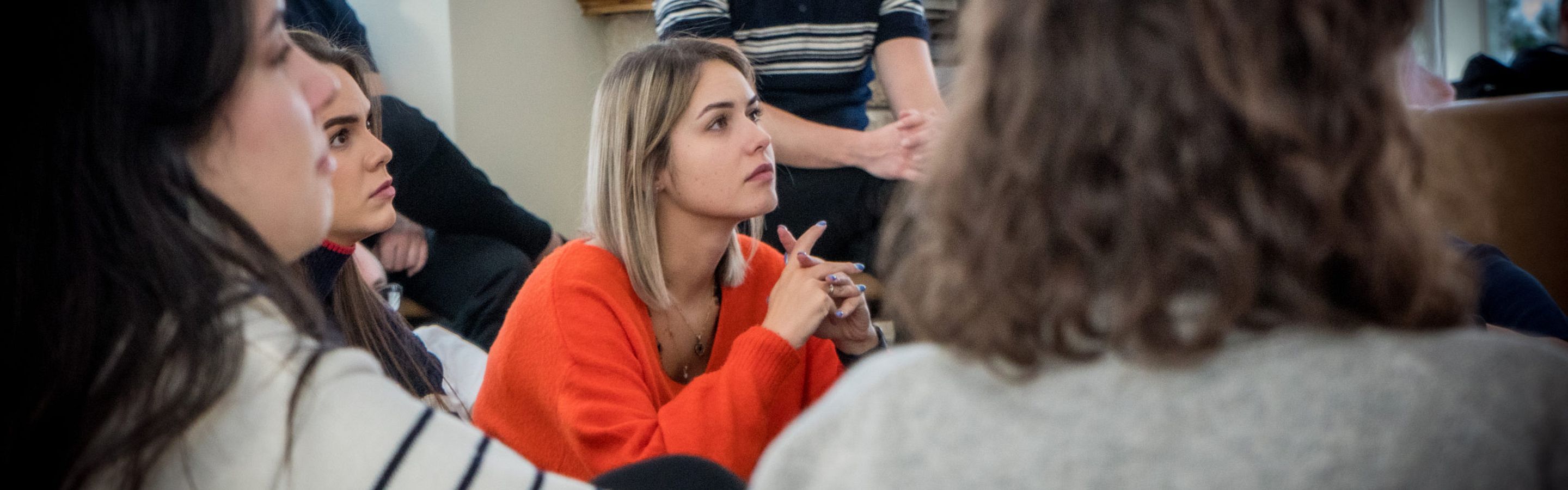 Young adults listen to speaker at retreat in Lithuania