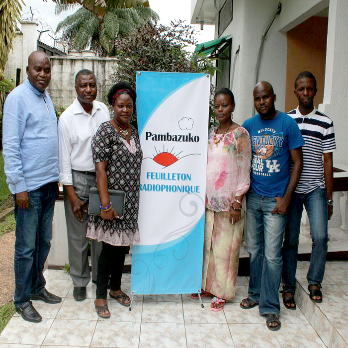 PMC staff stand in front a Pambazuko banner