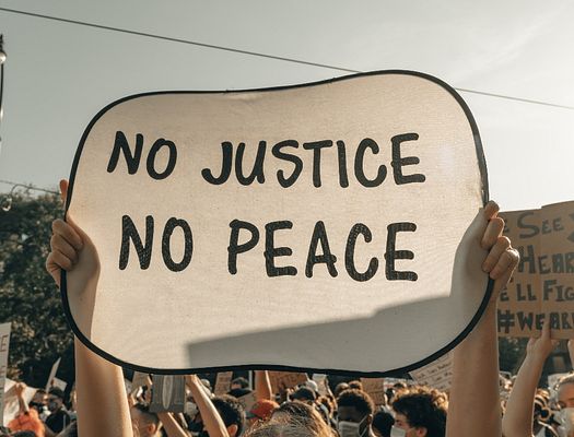 A sign that says "No Justice No Peace