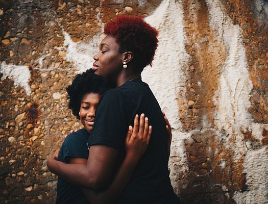 Mother and Daughter Embrace. Photo by Eye for Ebony on Unsplash.