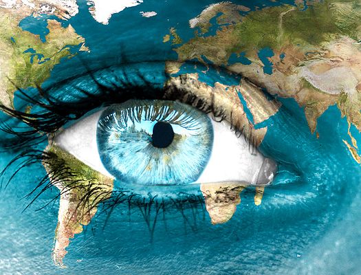 a world map with a human eye in the middle