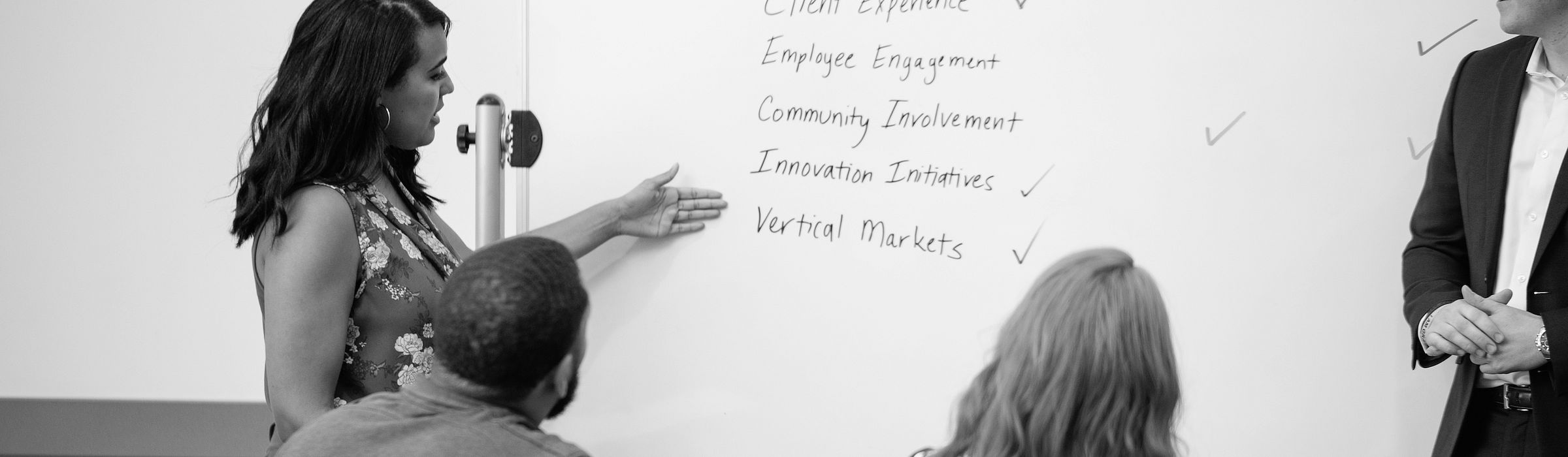Ideal Service Provider presenting ideas on a white board.