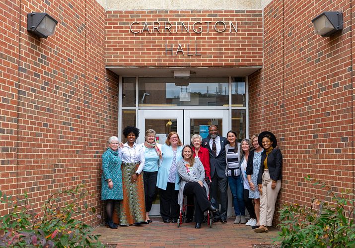 Group photo of the fall 2022 School of Nursing Alumni Association in front of an entrance to Carrington Hall.